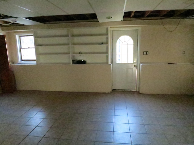 entryway featuring tile patterned floors and plenty of natural light