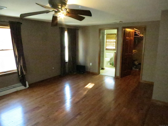 unfurnished room with dark hardwood / wood-style flooring and ceiling fan