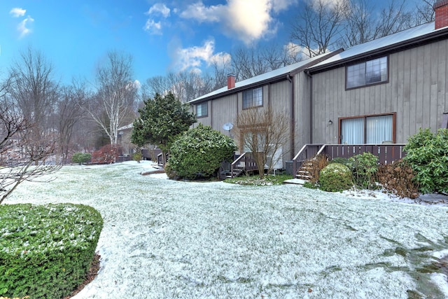 view of yard layered in snow