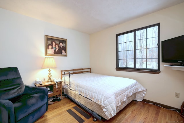 bedroom featuring hardwood / wood-style floors