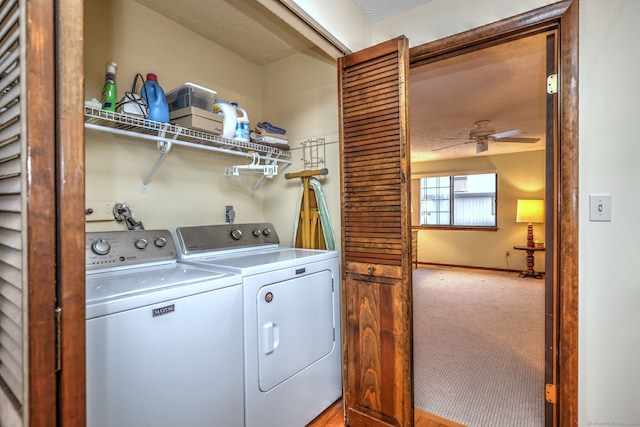 laundry room with carpet, ceiling fan, and washer and clothes dryer