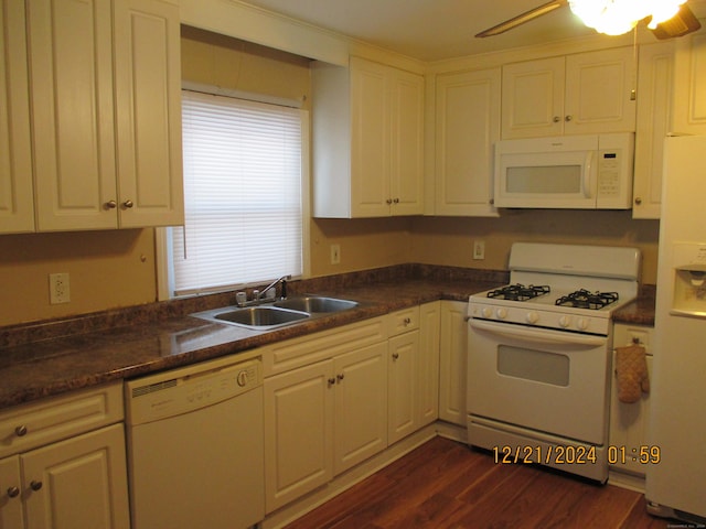 kitchen with white cabinetry, sink, ceiling fan, dark wood-type flooring, and white appliances