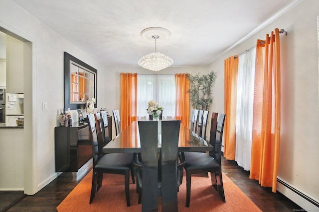 dining room featuring dark hardwood / wood-style flooring, a chandelier, and baseboard heating