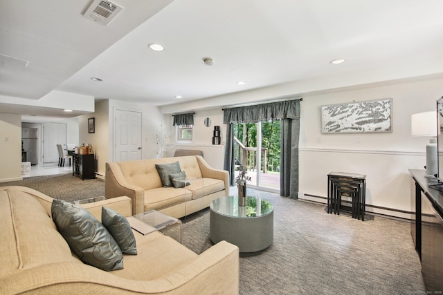 carpeted living room featuring a baseboard radiator