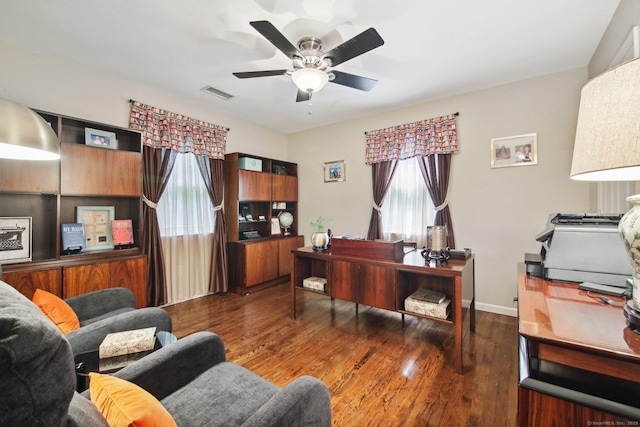 office featuring dark hardwood / wood-style floors and ceiling fan