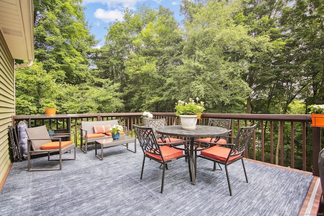 wooden terrace featuring outdoor lounge area