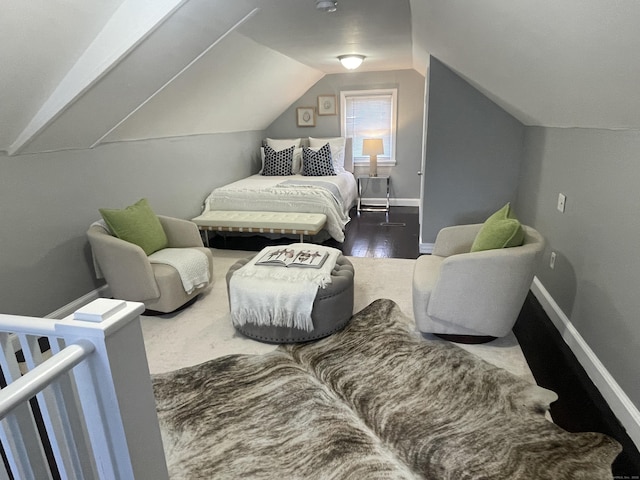 bedroom with hardwood / wood-style flooring and vaulted ceiling