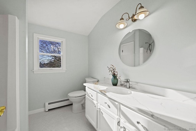 bathroom featuring baseboard heating, vanity, and toilet