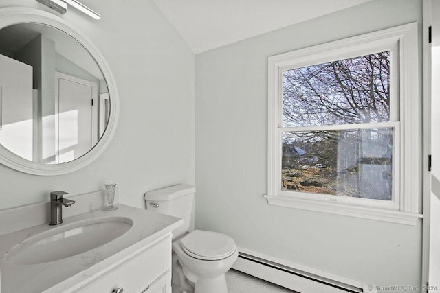 bathroom featuring a baseboard radiator, vanity, toilet, and lofted ceiling