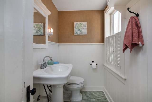 bathroom with tile patterned floors, toilet, and sink