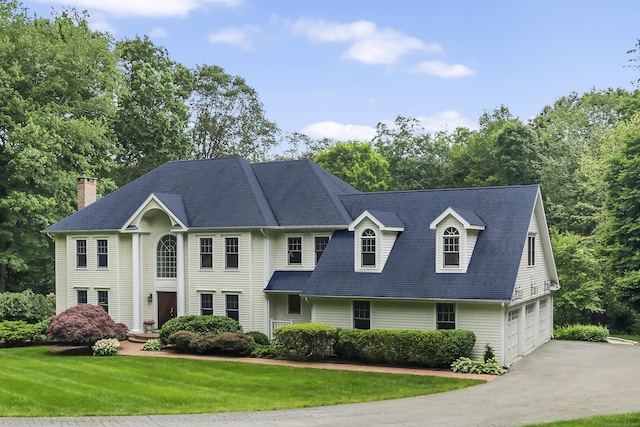 view of front facade featuring a garage and a front yard