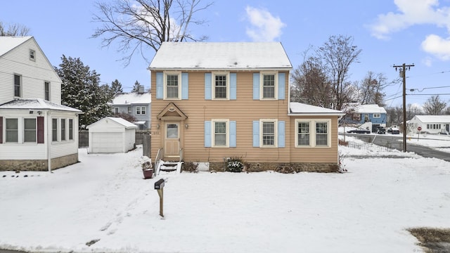 view of front of house featuring a garage and an outdoor structure