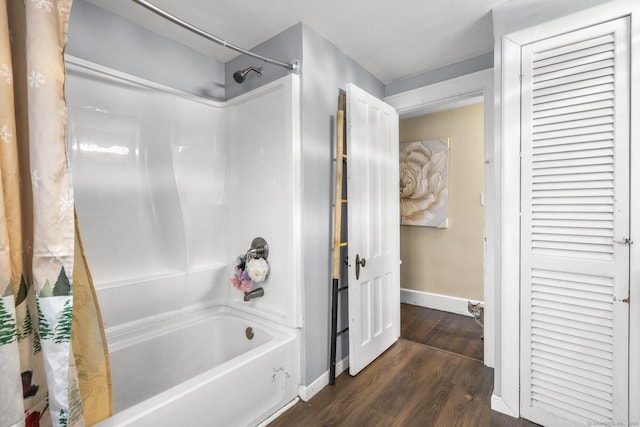 bathroom with shower / bathtub combination with curtain and hardwood / wood-style flooring