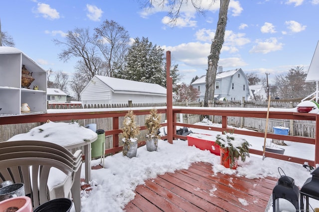 snow covered deck featuring grilling area