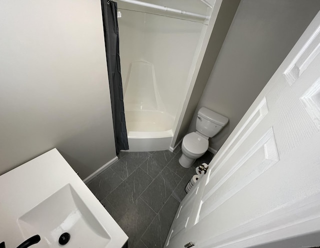 full bathroom featuring tile patterned floors, sink, shower / bathtub combination with curtain, and toilet