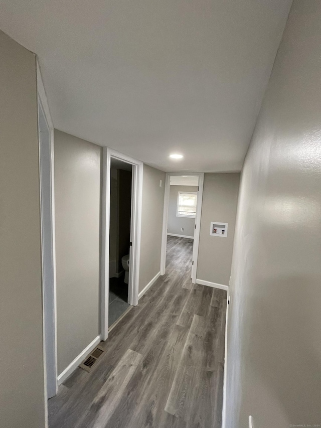 hall with dark hardwood / wood-style floors