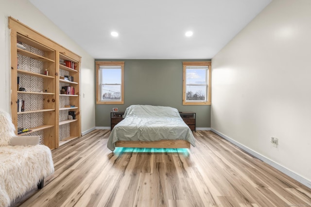 bedroom with light hardwood / wood-style flooring