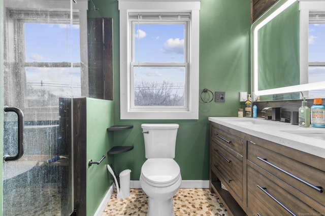 bathroom featuring tile patterned floors, vanity, and toilet