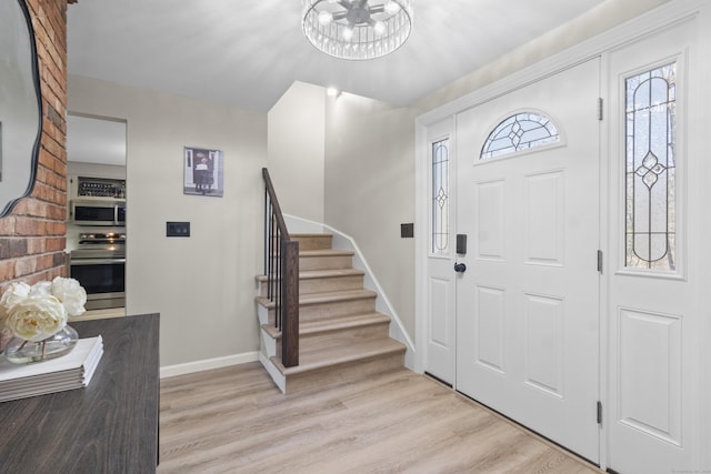 foyer entrance with light wood-type flooring