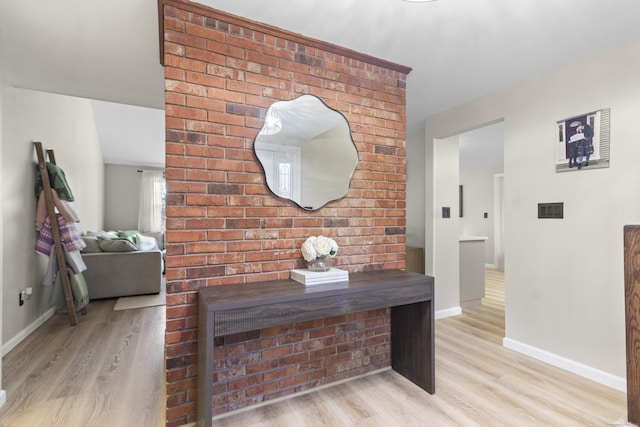 hallway with light hardwood / wood-style flooring