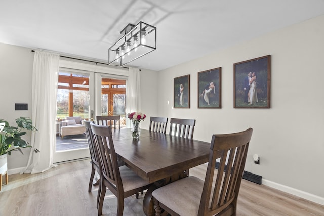 dining area featuring light hardwood / wood-style flooring and french doors