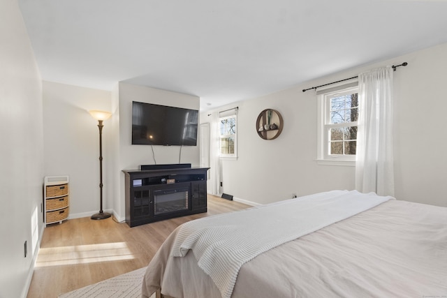 bedroom with light wood-type flooring