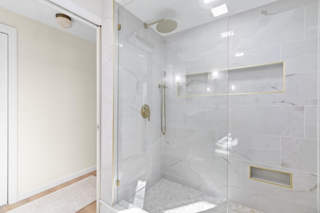 bathroom with a tile shower