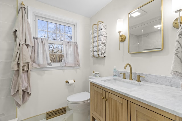 bathroom with vanity and toilet