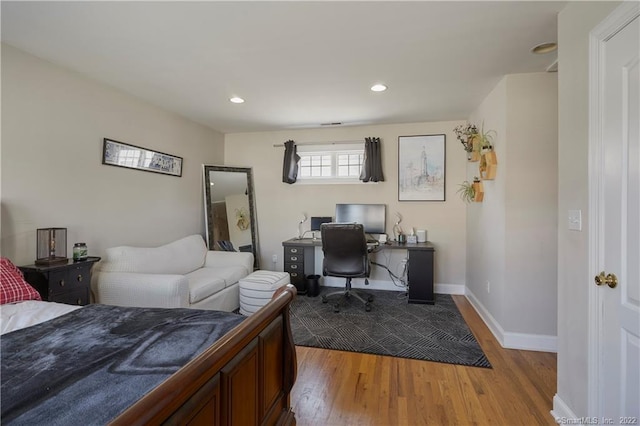 bedroom featuring hardwood / wood-style floors