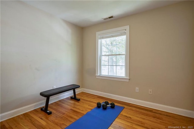 exercise area with hardwood / wood-style floors