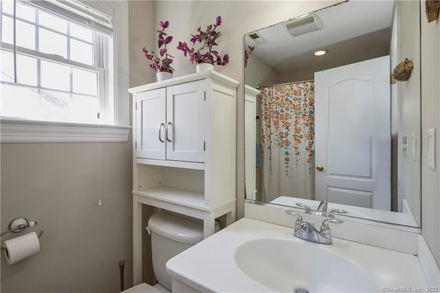 bathroom featuring sink and toilet