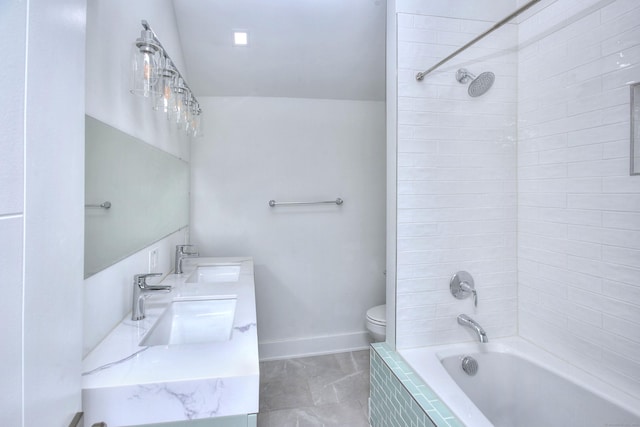 full bathroom featuring vanity, toilet, and tiled shower / bath