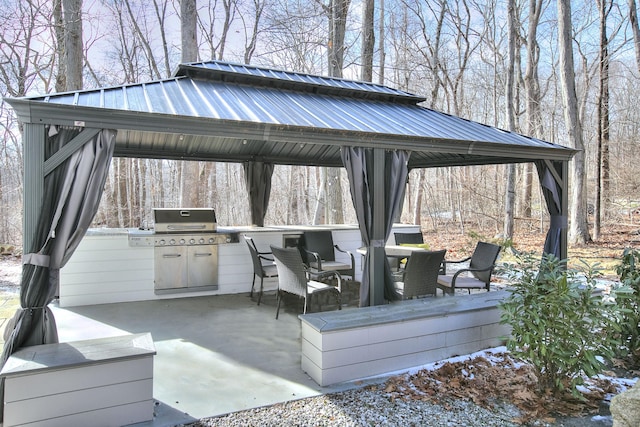 view of patio featuring a gazebo and exterior kitchen