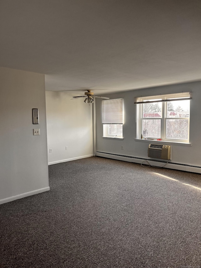 carpeted spare room featuring ceiling fan and a baseboard radiator