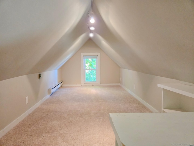 additional living space with carpet flooring, a baseboard radiator, and lofted ceiling