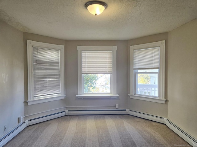 spare room with carpet floors and a textured ceiling