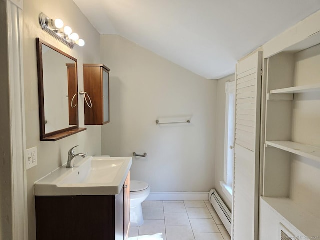 bathroom with tile patterned flooring, vanity, toilet, and a baseboard heating unit