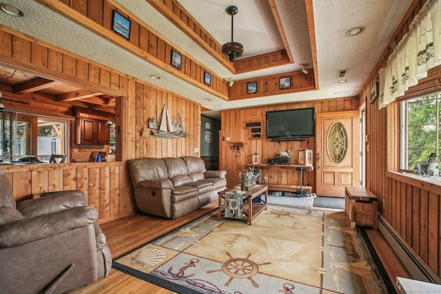 72 Providence Ave, Shelton, CT 06484 - living area featuring wooden walls, a baseboard heating unit, and wood finished floors