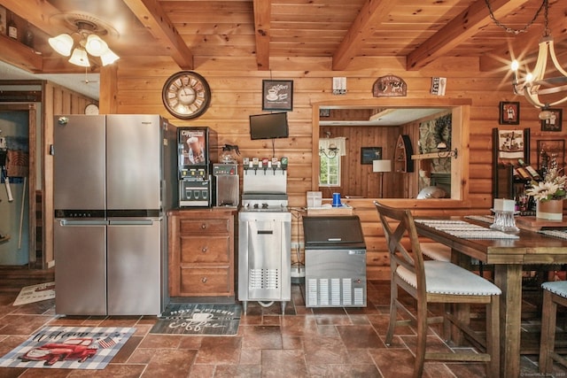 72 Providence Ave, Shelton, CT 06484 - kitchen with freestanding refrigerator, wooden walls, dark stone finish floors, a chandelier, and a wood ceiling with exposed beams