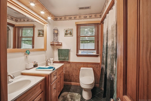 72 Providence Ave, Shelton, CT 06484 - bathroom with a wainscoted wall, two vanities, plenty of natural light, tile patterned flooring, and curtained shower