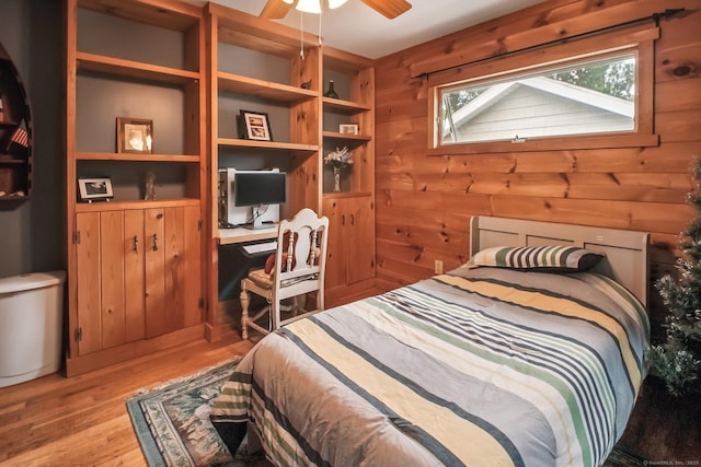 72 Providence Ave, Shelton, CT 06484 - bedroom with light wood finished floors, an office area, and wooden walls