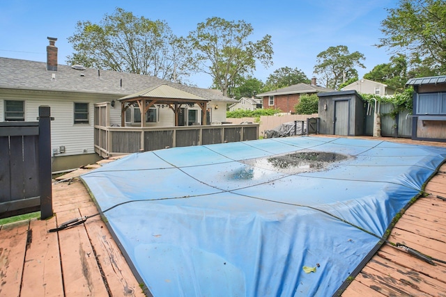 72 Providence Ave, Shelton, CT 06484 - view of swimming pool featuring a gazebo, a wooden deck, and a storage unit
