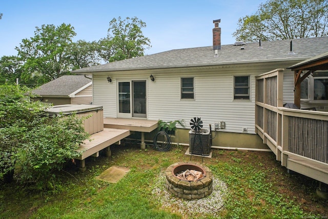 72 Providence Ave, Shelton, CT 06484 - back of property featuring an outdoor fire pit, a deck, a hot tub, a chimney, and roof with shingles