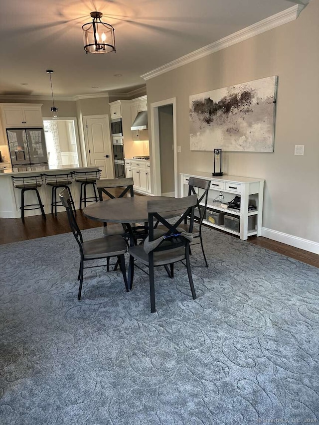 dining area with crown molding and dark wood-type flooring