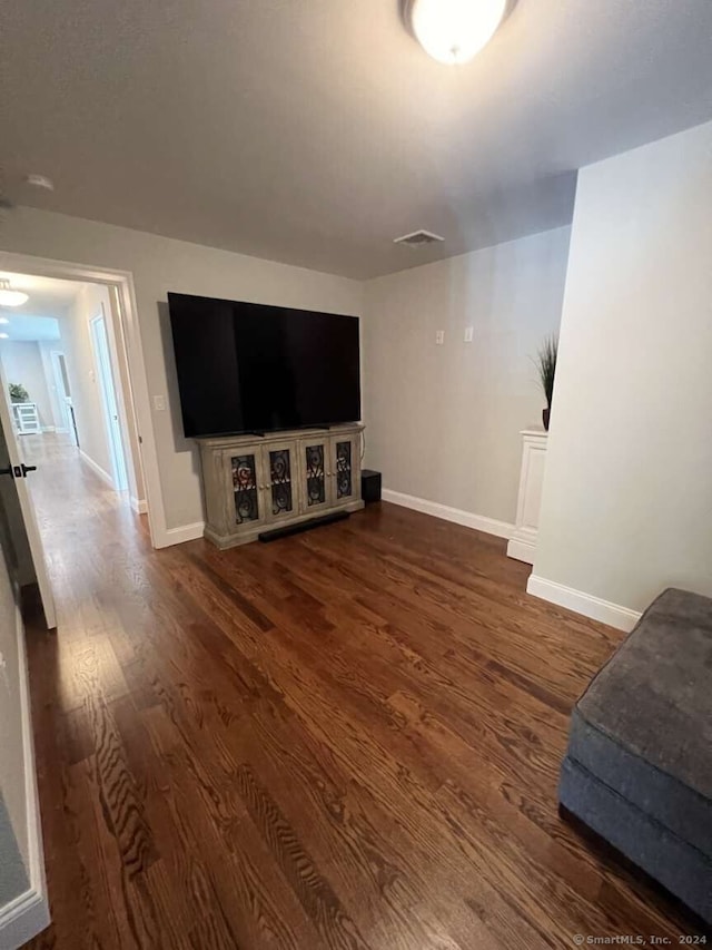 living room with dark wood-type flooring