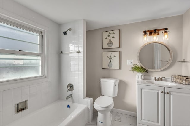 full bathroom with toilet, vanity, and tiled shower / bath