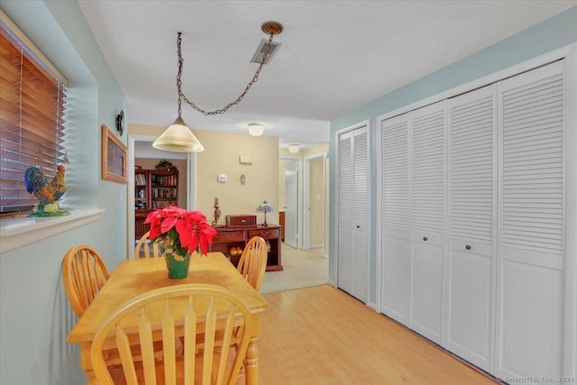 dining room featuring light hardwood / wood-style floors