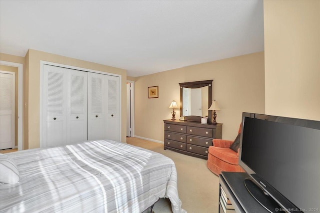 carpeted bedroom with a closet