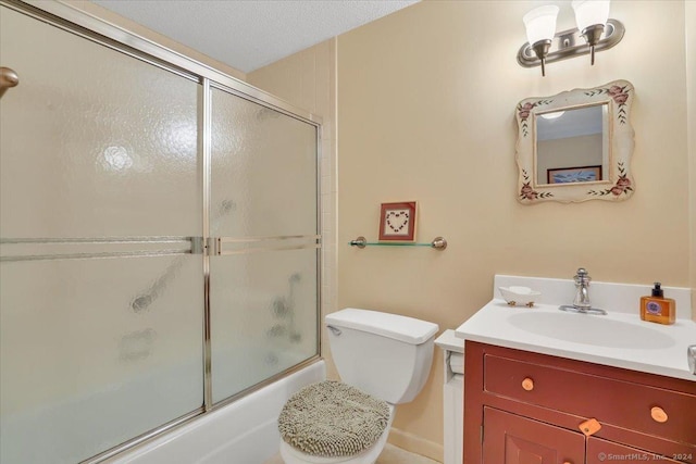 full bathroom featuring vanity, toilet, enclosed tub / shower combo, and a textured ceiling