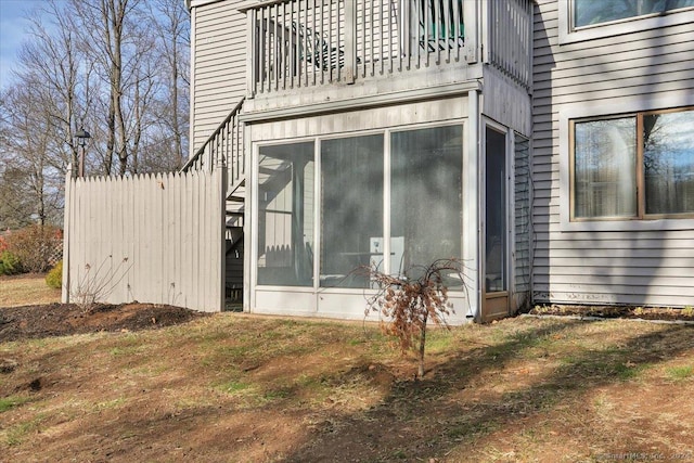 view of side of home with a sunroom